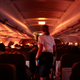 DALLAS, TX - NOVEMBER 24: A flight attendant walks through an airplane before the plane’s descent into the Dallas/Fort Worth International Airport on November 24, 2021 in Dallas, Texas.